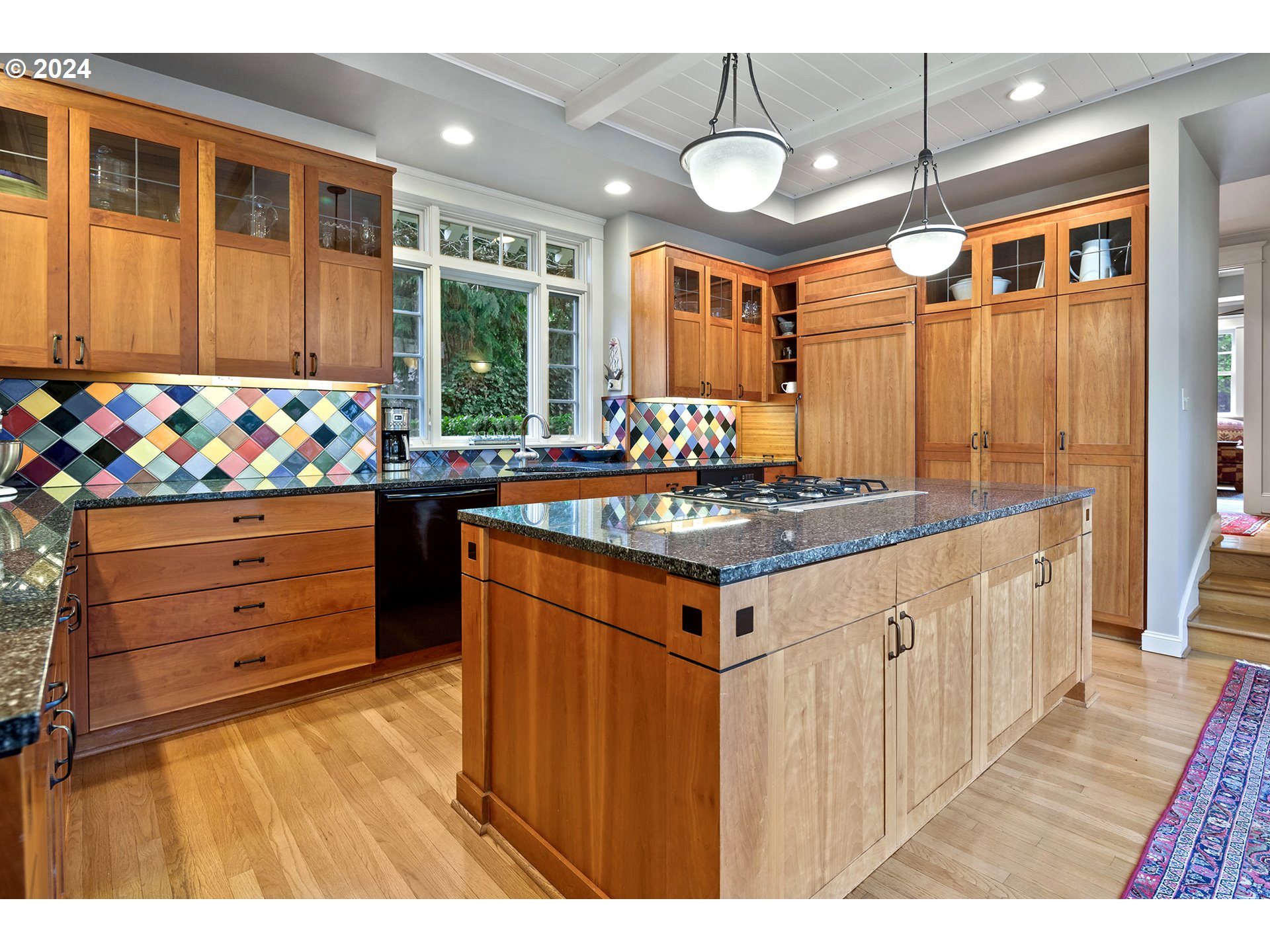 1803 South Riverdale Road Portland, OR 97219 - Photo 18 of 48 a kitchen that has a lot of cabinets in it