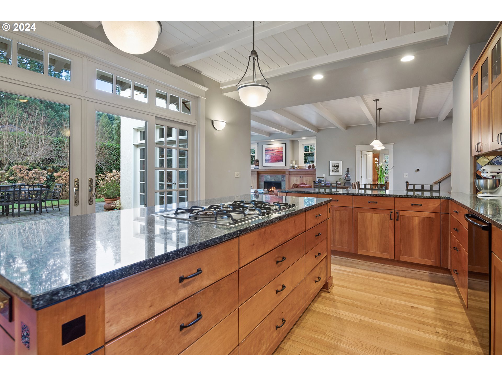 1803 South Riverdale Road Portland, OR 97219 - Photo 19 of 48 a large kitchen with kitchen island a large counter space wooden floor and stainless steel appliances