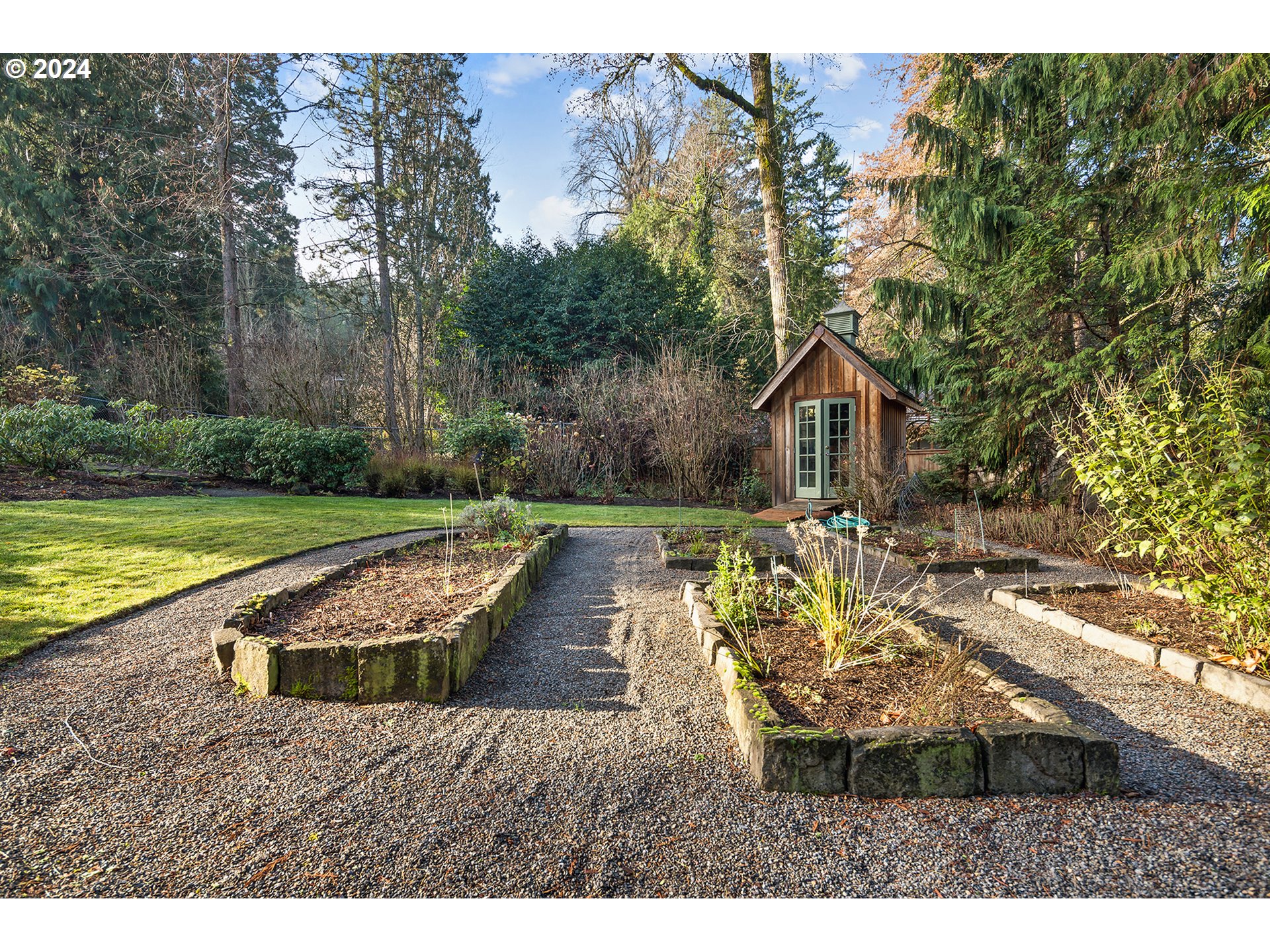1803 South Riverdale Road Portland, OR 97219 - Photo 25 of 48 a view of a house with backyard and sitting area