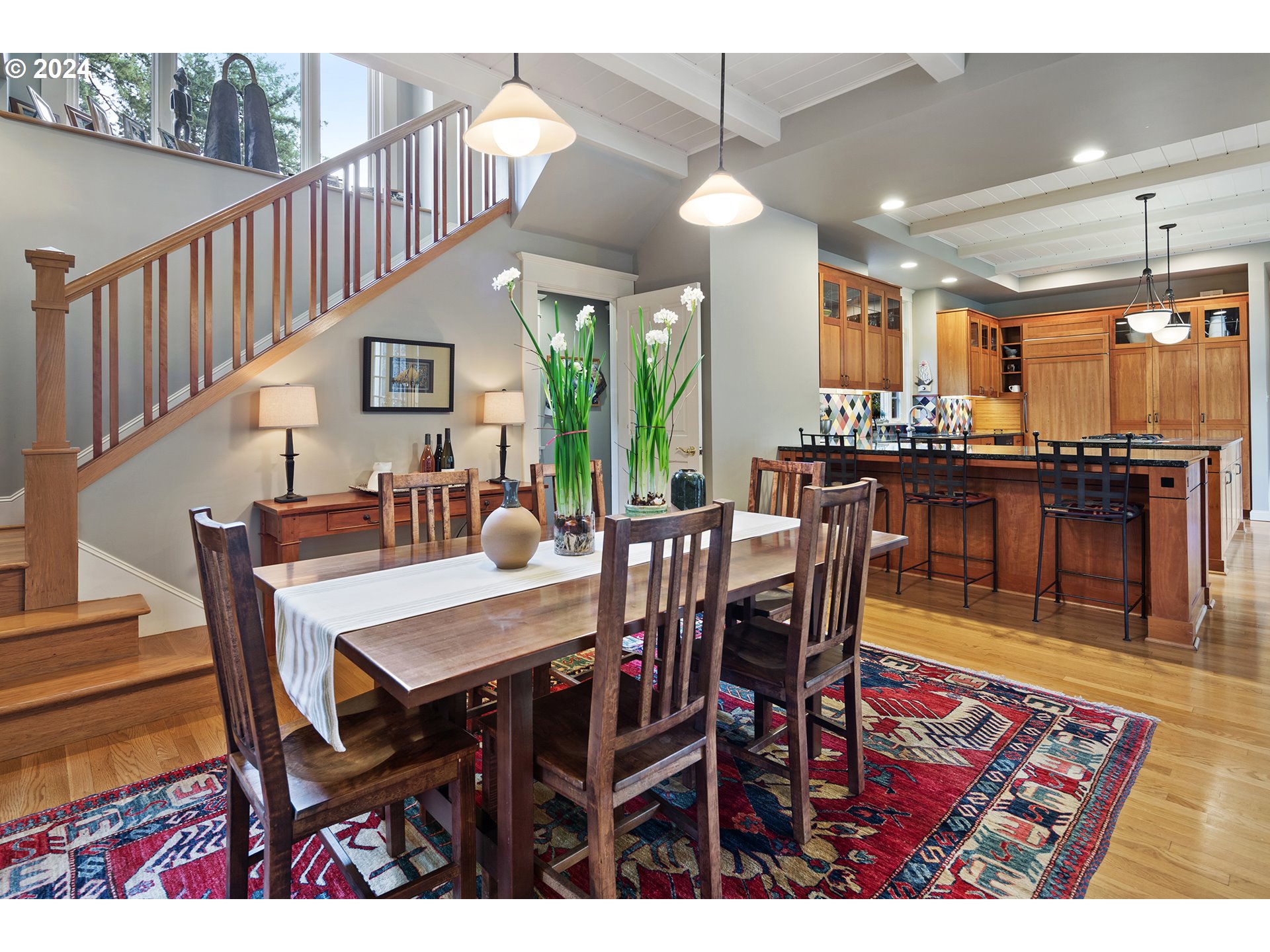 1803 South Riverdale Road Portland, OR 97219 - Photo 29 of 48 a view of a dining room and livingroom with furniture wooden floor a rug a painting and a chandelier