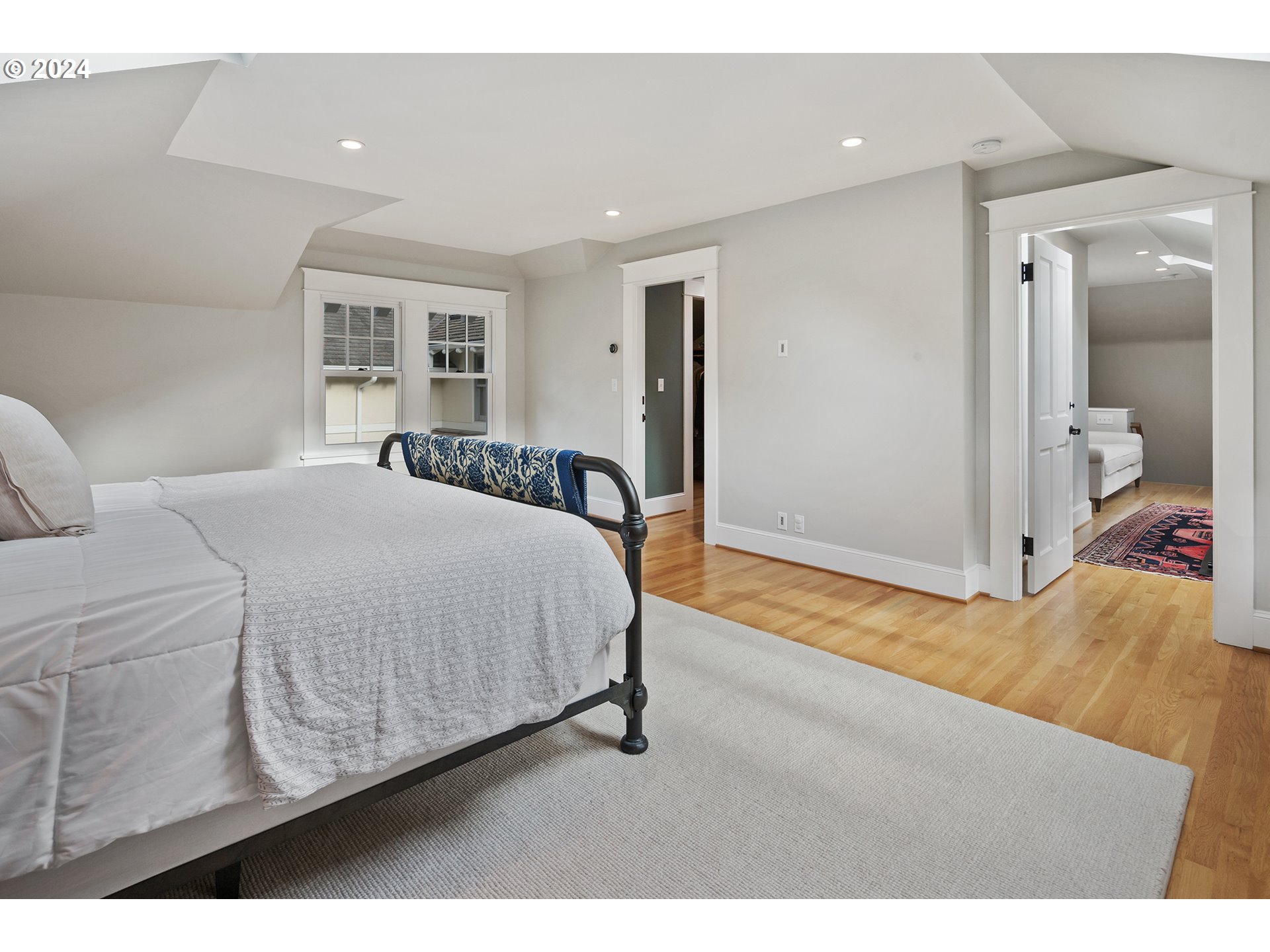 1803 South Riverdale Road Portland, OR 97219 - Photo 34 of 48 a bedroom with a bed and a painting on the wall