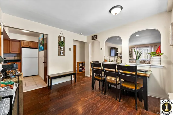 a view of a dining room with furniture and wooden floor