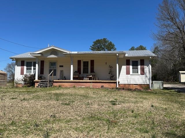1555 Rich Road Savannah, TN 38372 - Photo 1 of 18 View of front of property with central AC unit, a porch, and a front yard