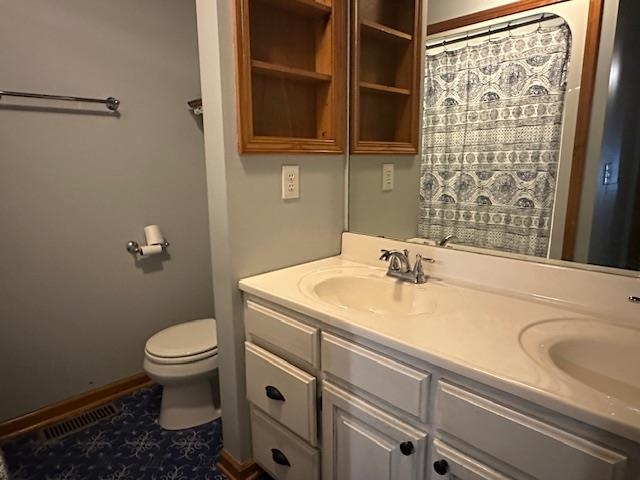 1555 Rich Road Savannah, TN 38372 - Photo 11 of 18 Bathroom featuring toilet, a sink, double vanity, and visible vents