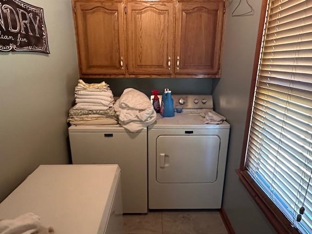 1555 Rich Road Savannah, TN 38372 - Photo 13 of 18 Laundry room featuring light tile patterned floors, cabinet space, and washer and clothes dryer