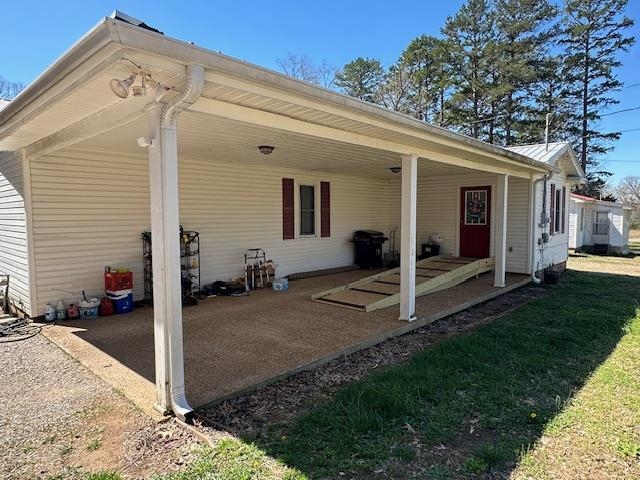 1555 Rich Road Savannah, TN 38372 - Photo 14 of 18 Exterior space with a lawn