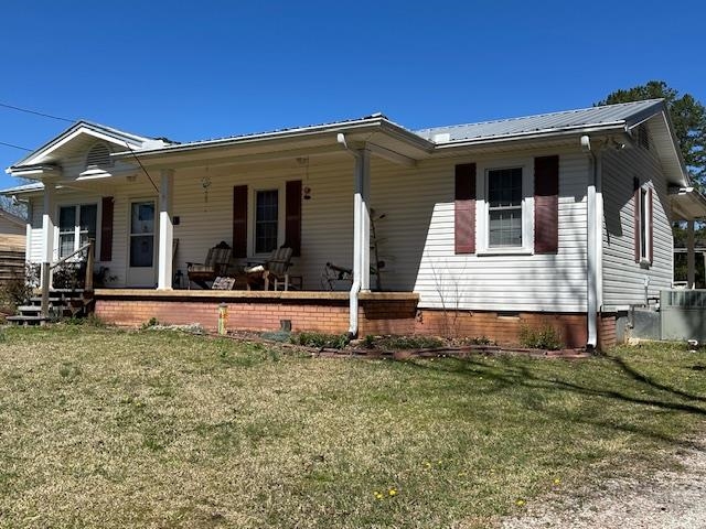 1555 Rich Road Savannah, TN 38372 - Photo 17 of 18 View of front of property with metal roof, a front yard, and a porch