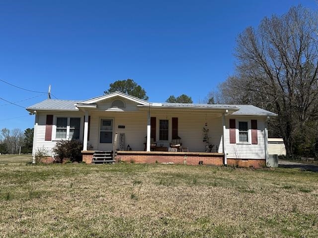 1555 Rich Road Savannah, TN 38372 - Photo 18 of 18 Single story home featuring metal roof, a front lawn, and a porch
