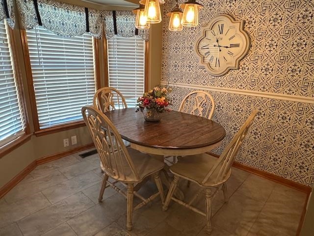 1555 Rich Road Savannah, TN 38372 - Photo 5 of 18 Dining room featuring baseboards, visible vents, and wallpapered walls