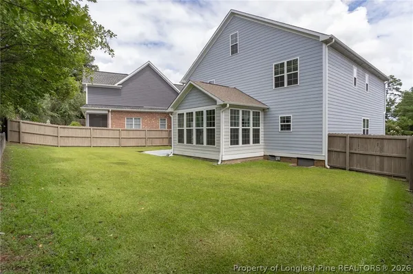 a view of a house with a backyard