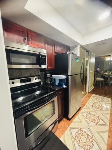 a kitchen with a stove and a microwave