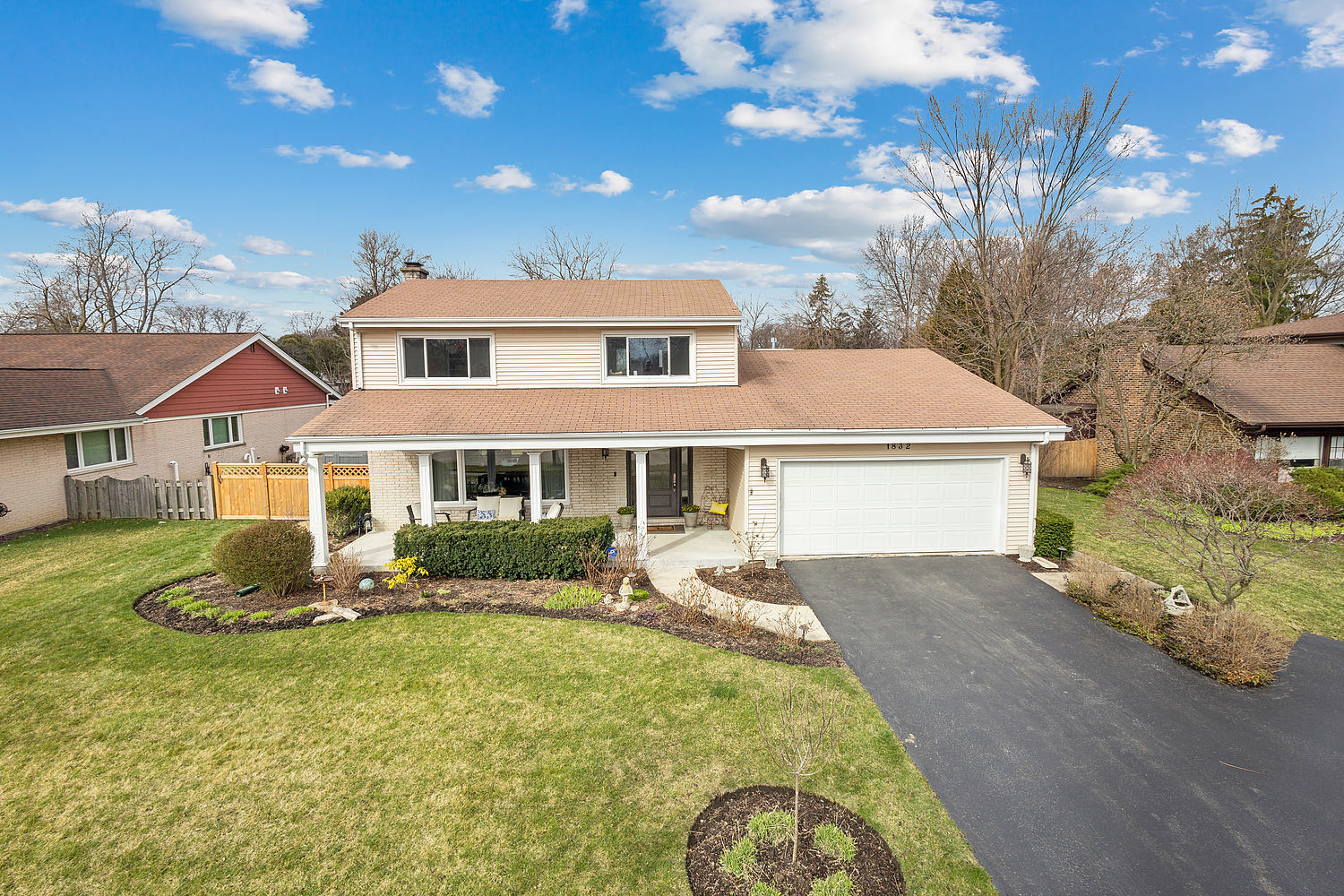 1832 Birch Road Northbrook, IL 60062 - Photo 1 of 28 a front view of a house with a yard