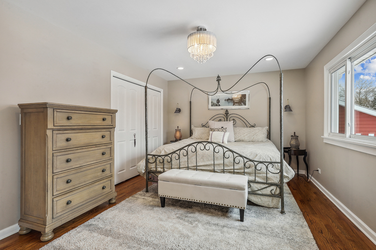 1832 Birch Road Northbrook, IL 60062 - Photo 17 of 28 a bedroom with a bed and a chandelier