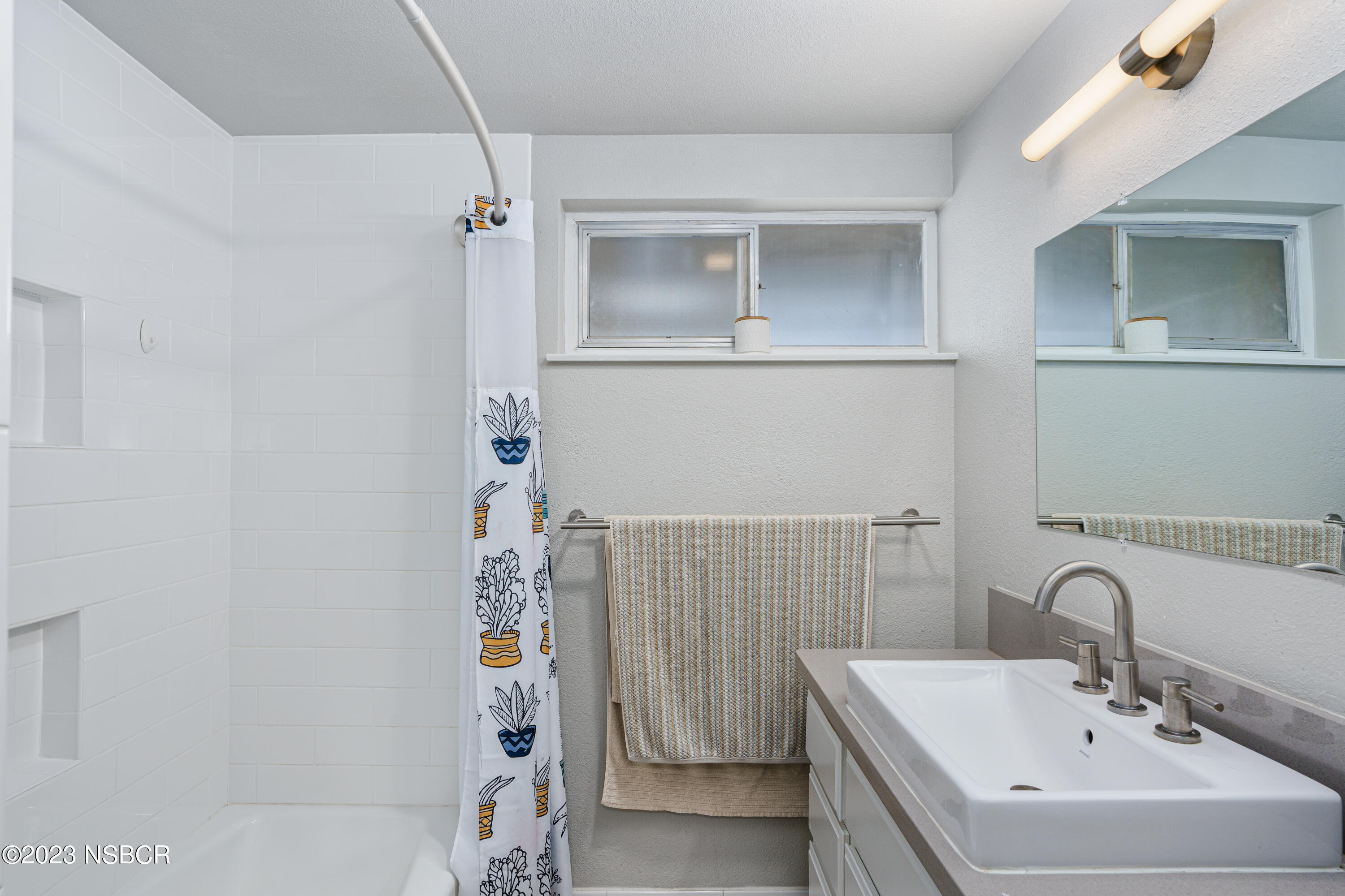 509 North Poppy Street Lompoc, CA 93436 - Photo 16 of 36 a bathroom with a sink and mirror