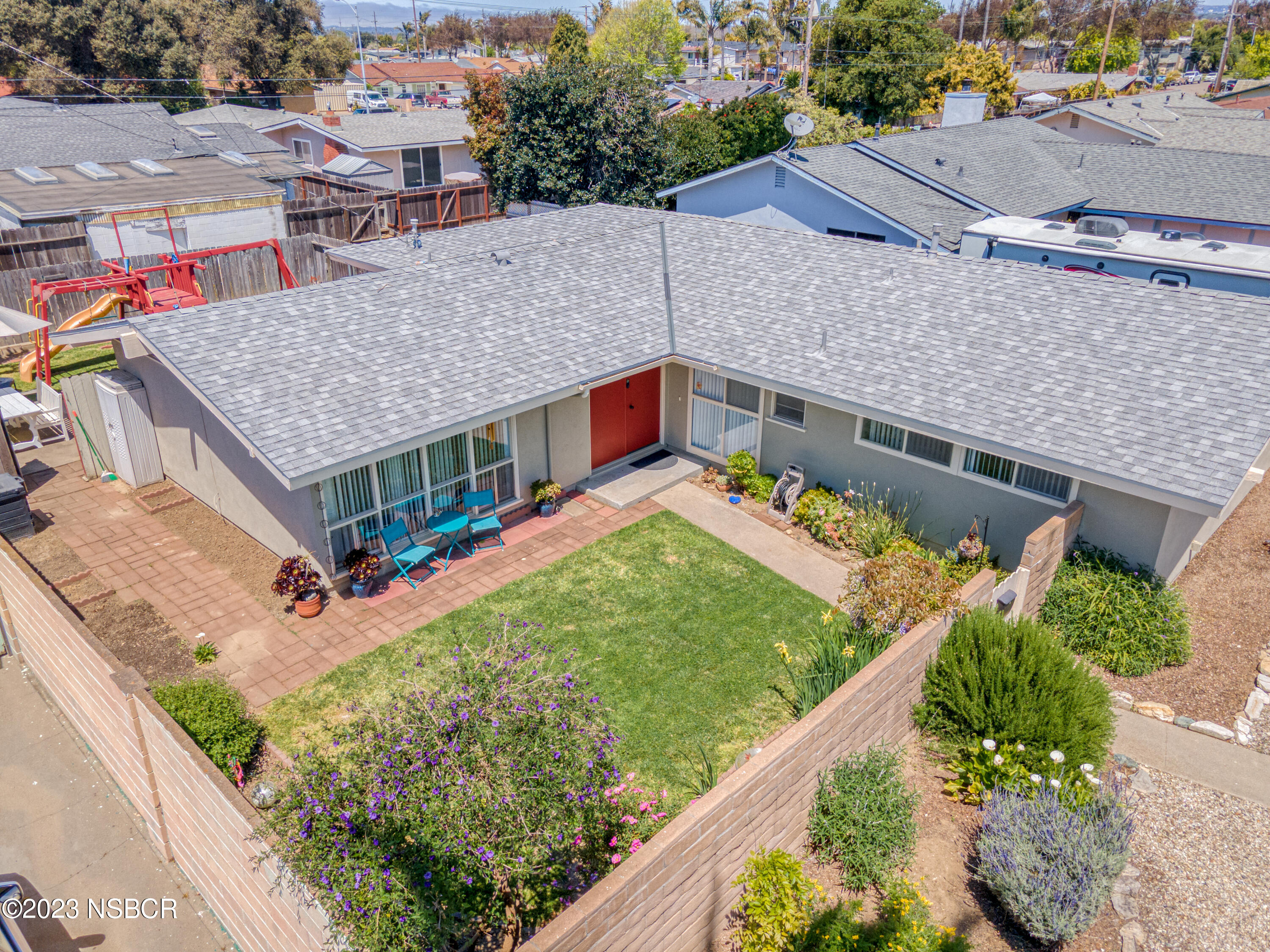 509 North Poppy Street Lompoc, CA 93436 - Photo 28 of 36 an aerial view of a house with a garden