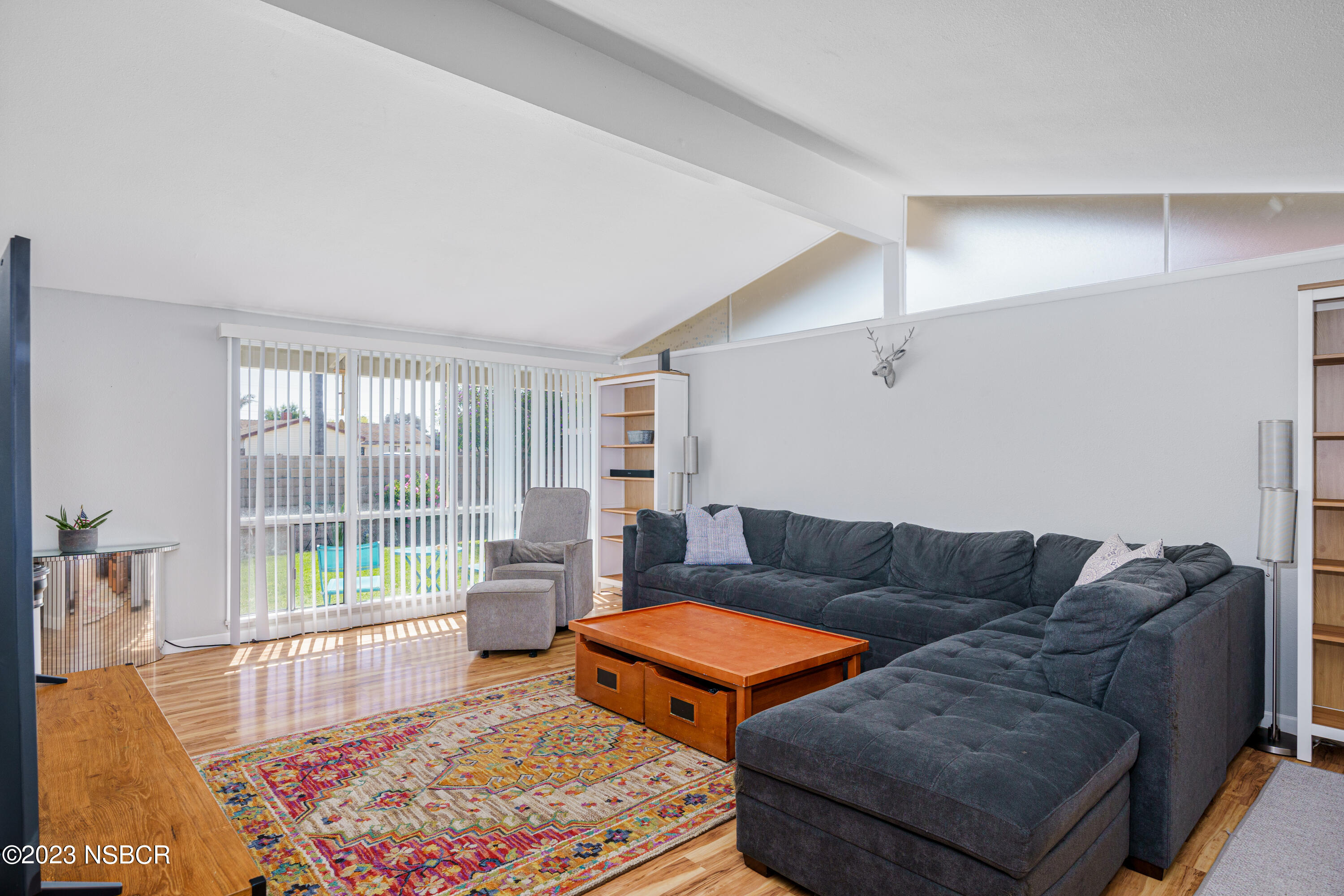 509 North Poppy Street Lompoc, CA 93436 - Photo 8 of 36 a living room with furniture and a rug