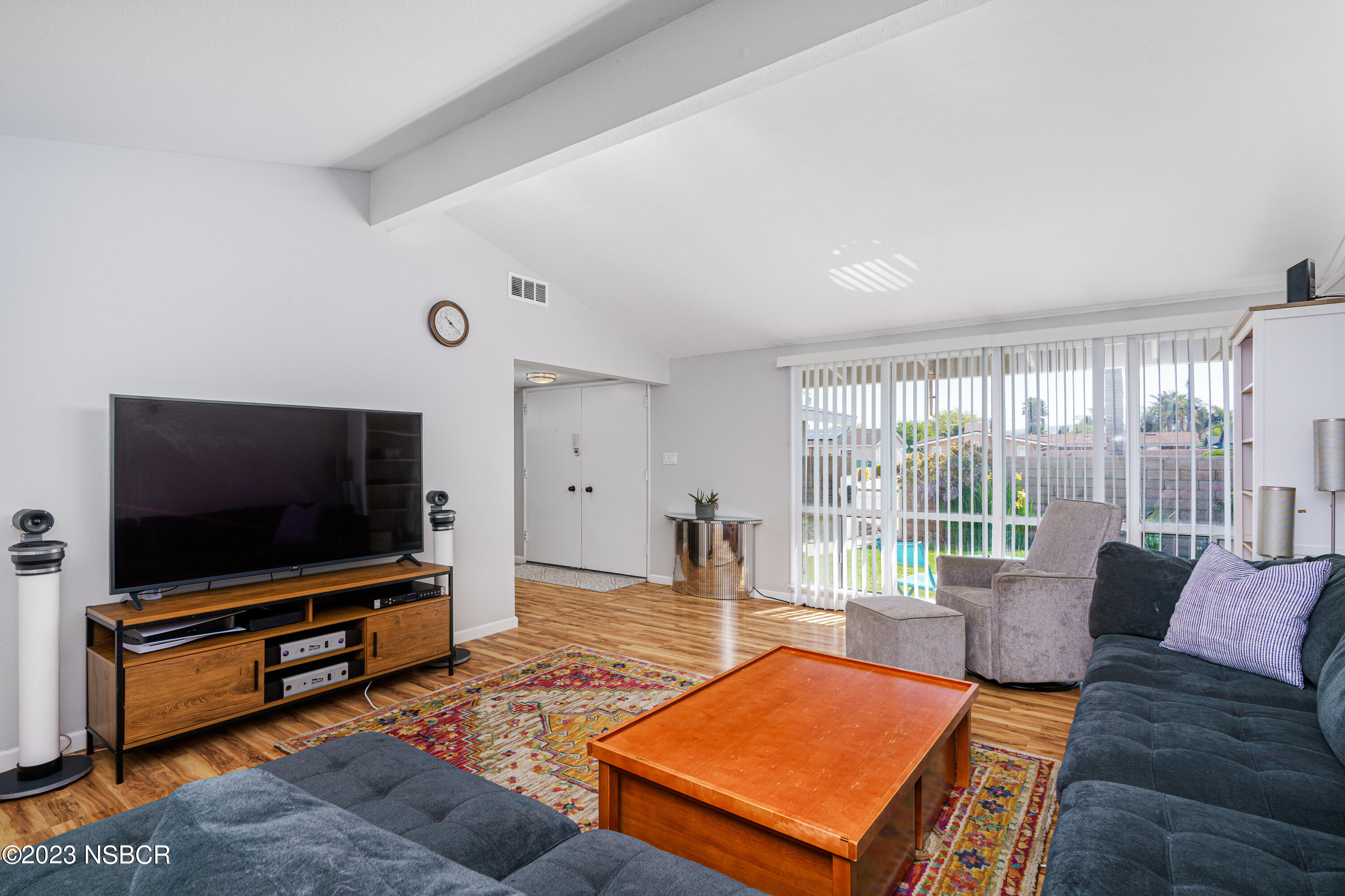 509 North Poppy Street Lompoc, CA 93436 - Photo 9 of 36 a living room with furniture and a flat screen tv