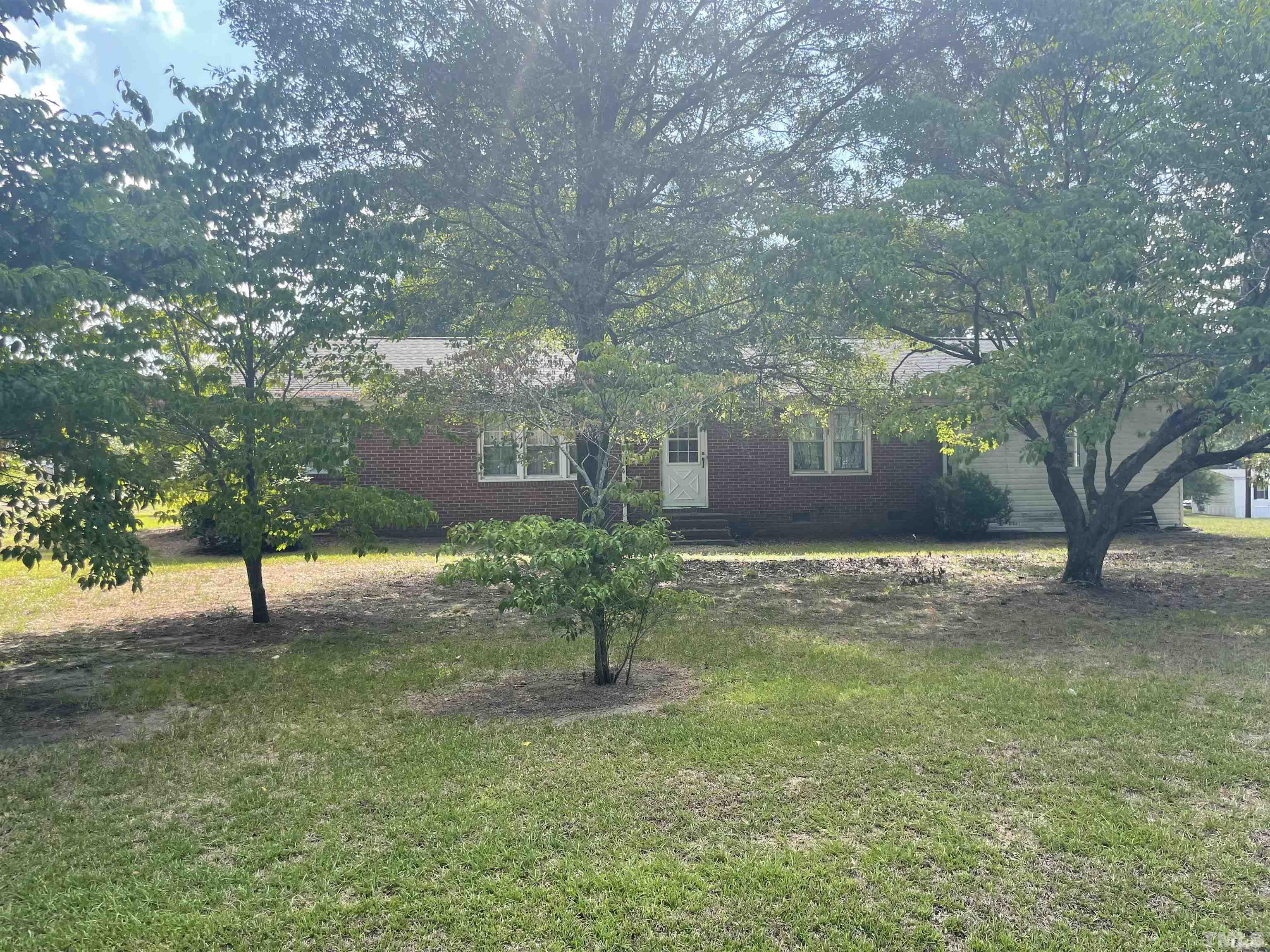4978 Zacks Mill Road Angier, NC 27501 - Photo 4 of 11 a view of a yard with a tree