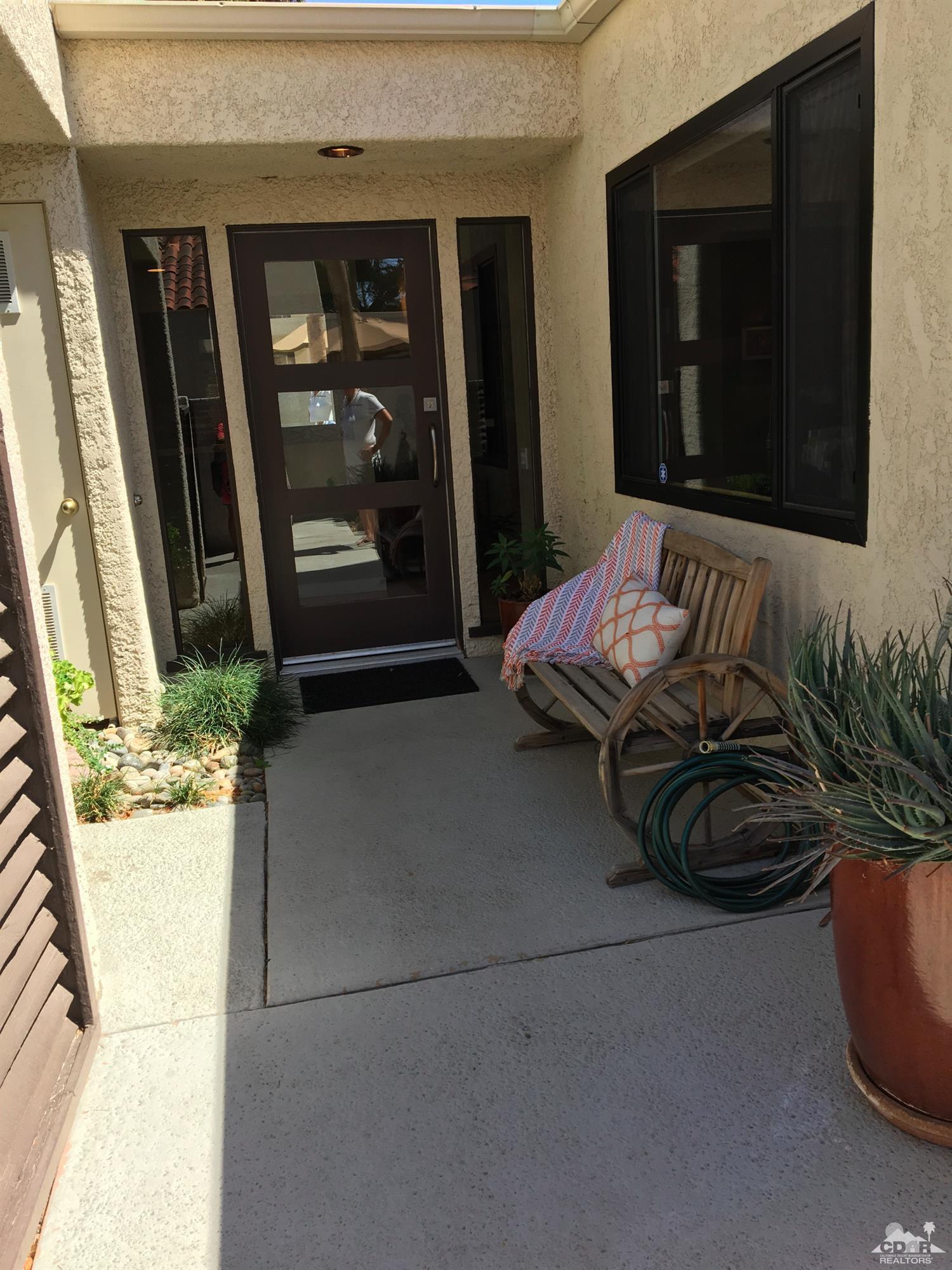 142 South Racquet Club Drive Rancho Mirage, CA 92270 - Photo 22 of 24 a bed sitting in front of a window