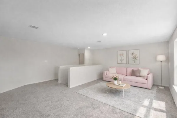 a living room with furniture and a couch