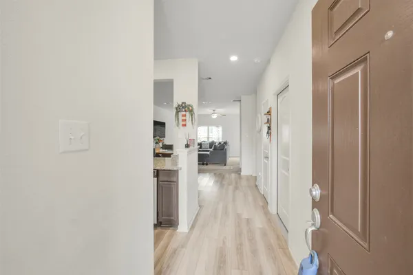 a view of a living room with a wooden floor