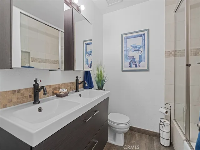 a bathroom with sink granite and a vanity