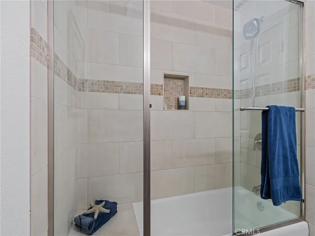 a bathroom with a sink mirror and toilet