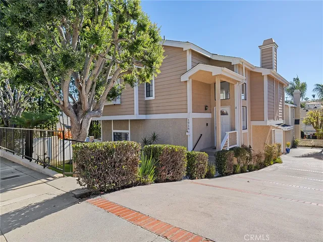 a room with stainless steel appliances kitchen island granite countertop a dining table chairs and granite counter top