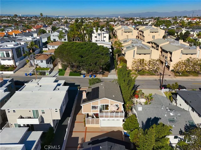 an aerial view of houses with an outdoor space
