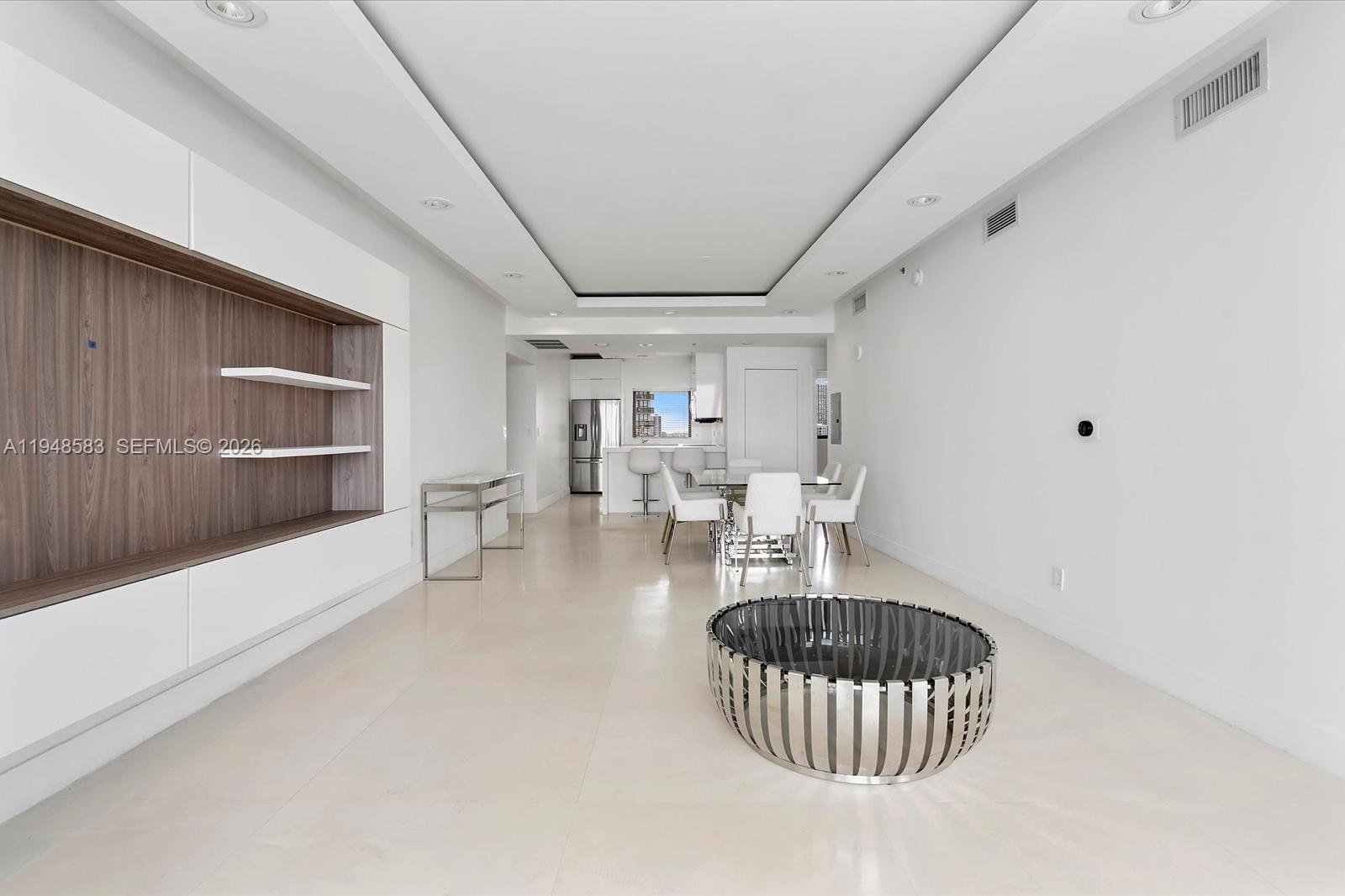 601 Northeast 36th Street, Unit 1310 Miami, FL 33137 - Photo 11 of 40 a living room with furniture and a window