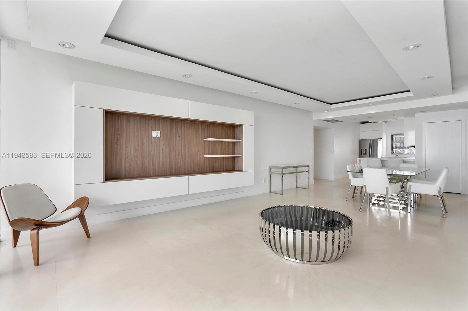 601 Northeast 36th Street, Unit 1310 Miami, FL 33137 - Photo 14 of 40 a living room with furniture and a table