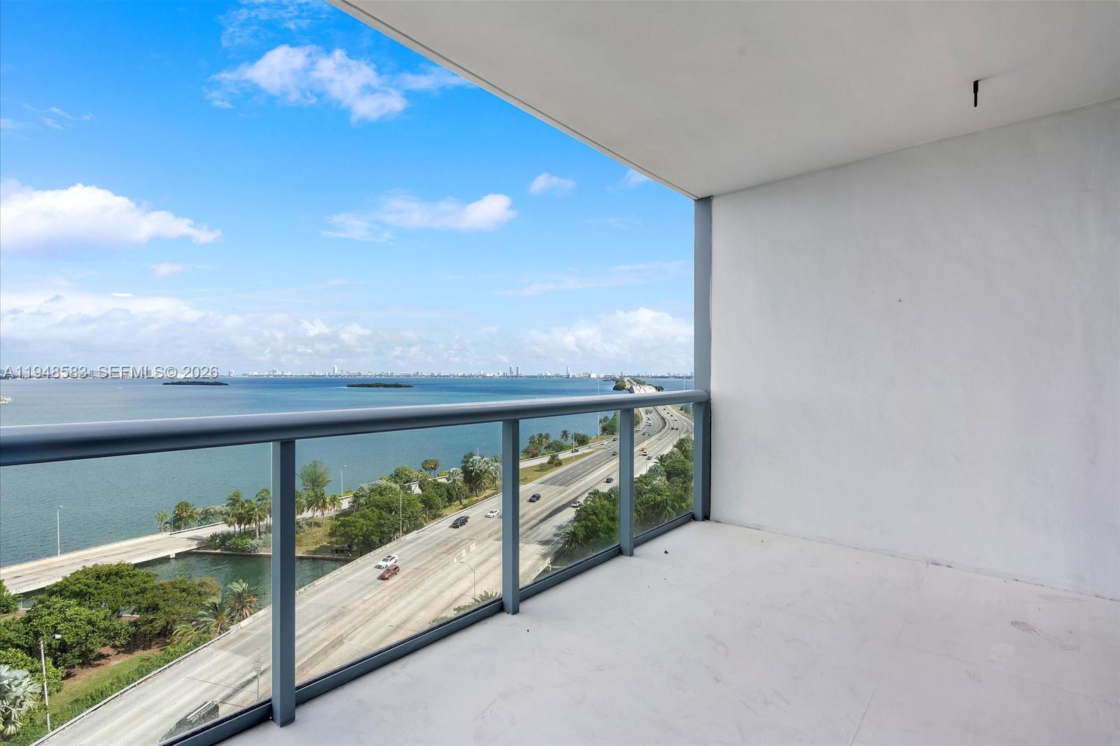 601 Northeast 36th Street, Unit 1310 Miami, FL 33137 - Photo 27 of 40 a view of balcony with floor to ceiling window and wooden floor