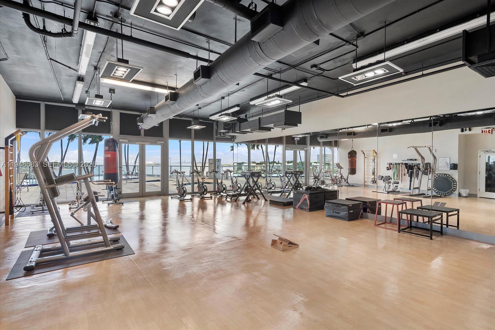 601 Northeast 36th Street, Unit 1310 Miami, FL 33137 - Photo 33 of 40 a view of a room with gym equipment