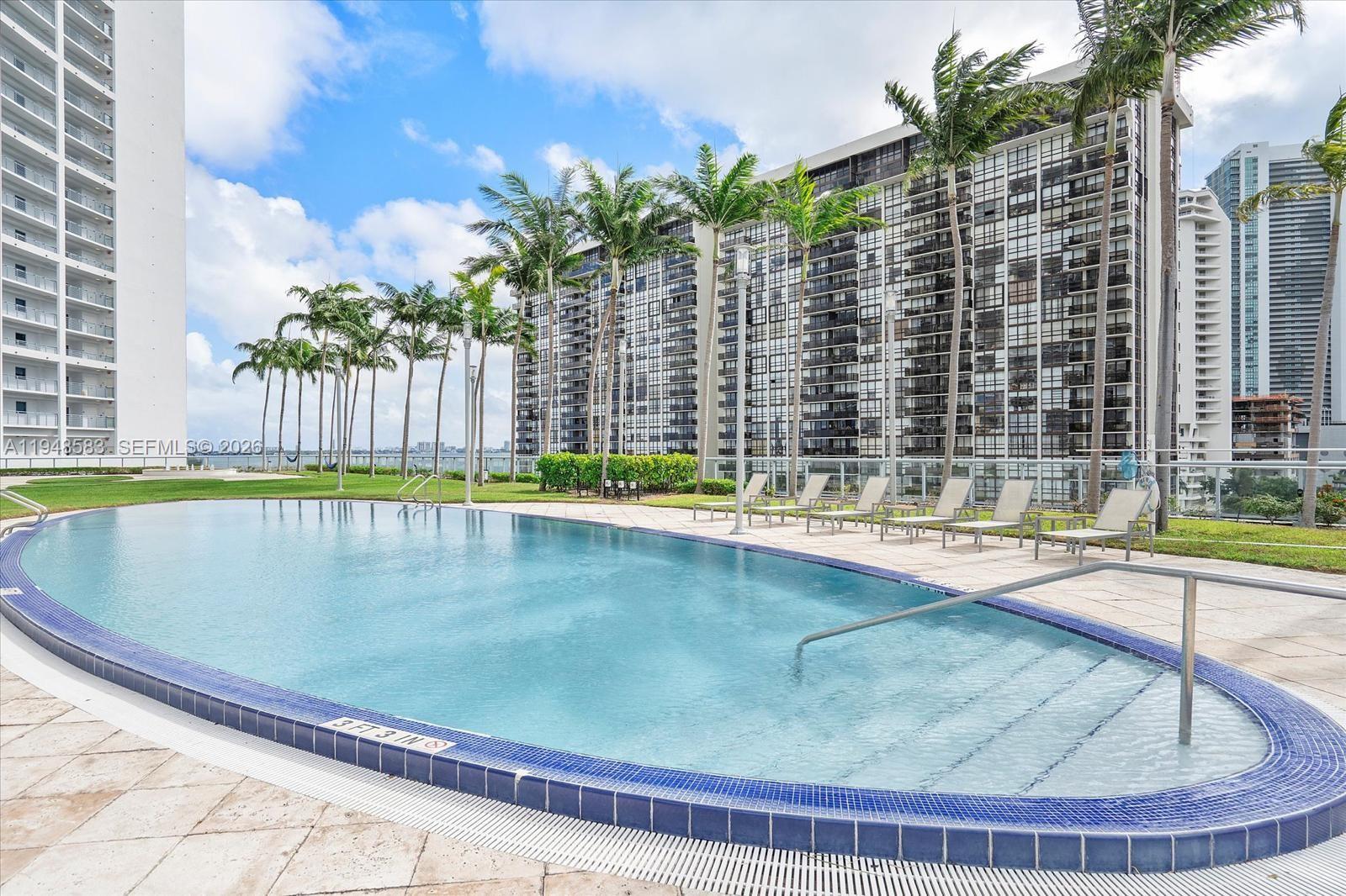 601 Northeast 36th Street, Unit 1310 Miami, FL 33137 - Photo 36 of 40 a view of swimming pool from a balcony