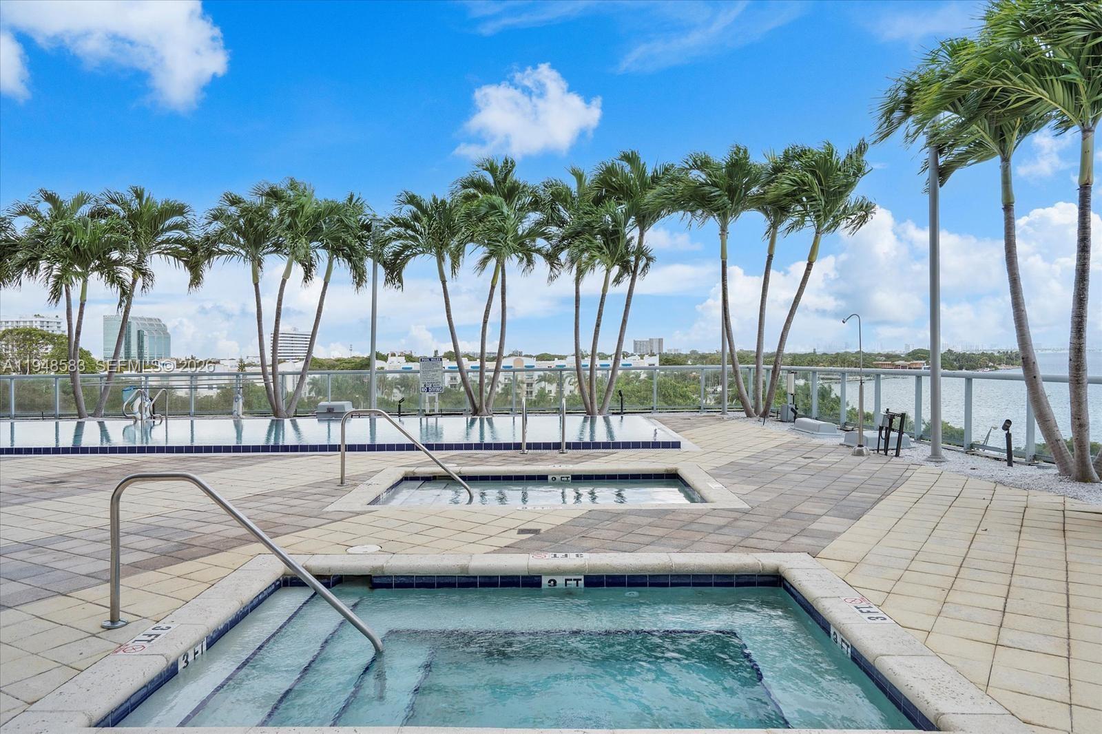 601 Northeast 36th Street, Unit 1310 Miami, FL 33137 - Photo 37 of 40 a view of swimming pool with chairs