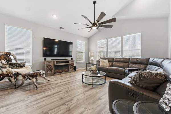 a kitchen with stainless steel appliances a refrigerator stove microwave and cabinets