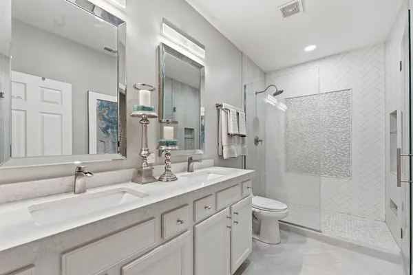 a bathroom with a sink toilet and shower