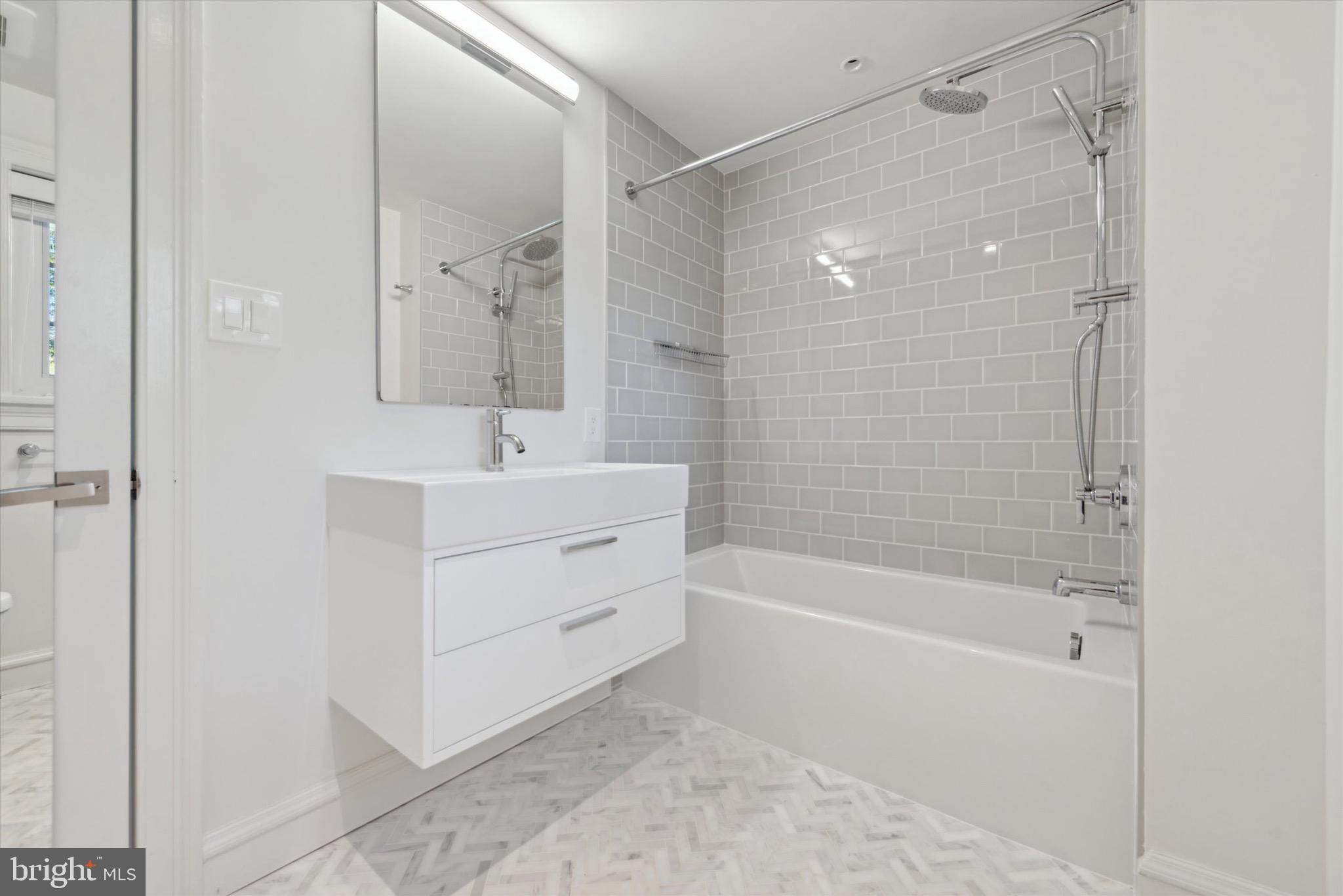 767-769 Newtown Road Villanova, PA 19085 - Photo 24 of 26 a bathroom with a bathtub and a shower