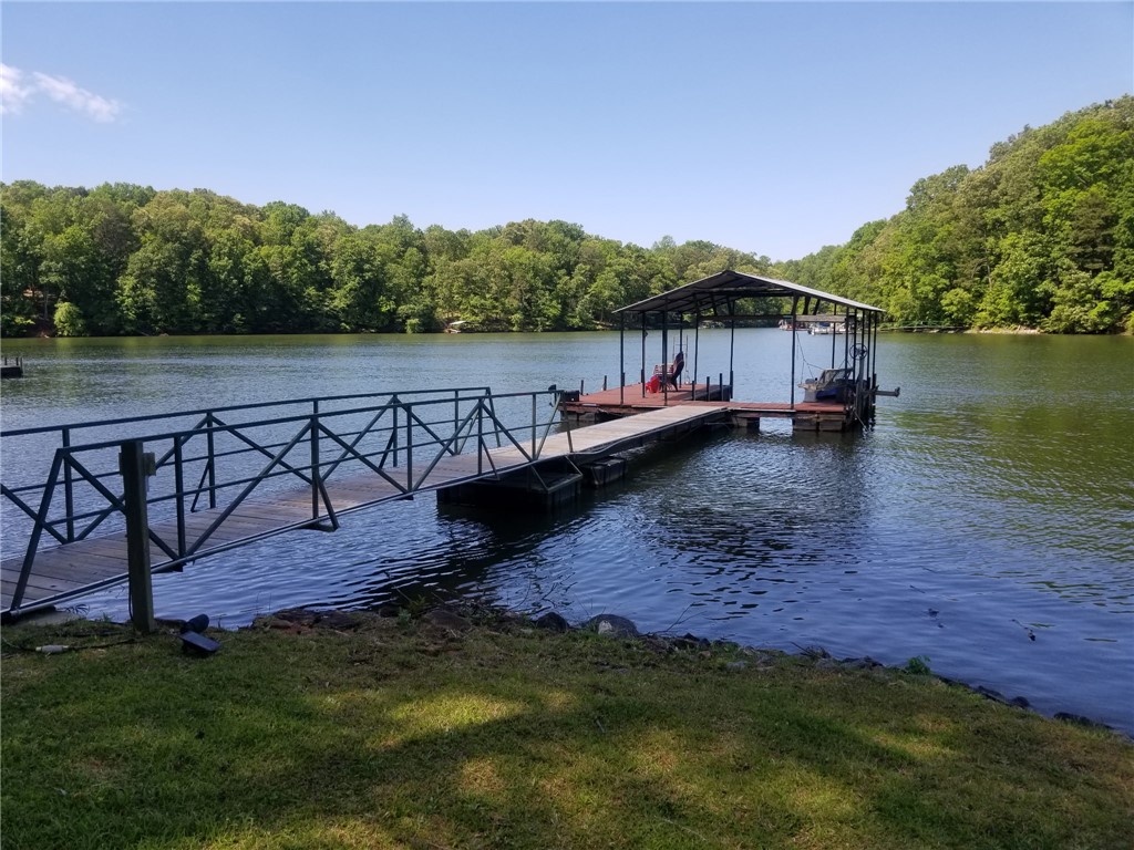 110 Snug Harbor Road Seneca, SC 29678 - Photo 2 of 37 This serene waterfront property offers direct access to the lake with a private dock. Picture taken at full pond.