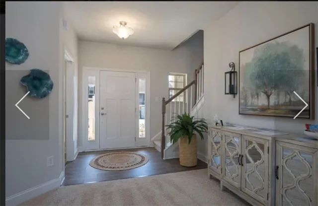 a view of entryway with wooden floor