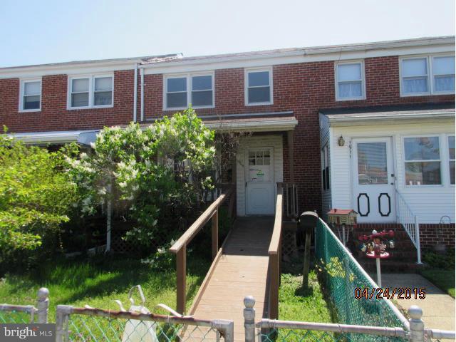 1909 Barry Road Baltimore, MD 21222 - Photo 1 of 12 front view of a brick house with a yard