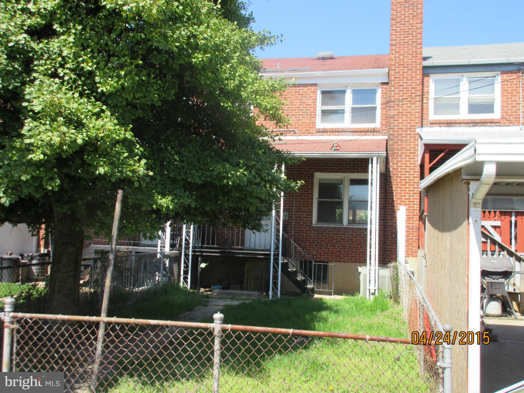 1909 Barry Road Baltimore, MD 21222 - Photo 11 of 12 a front view of a house with garden