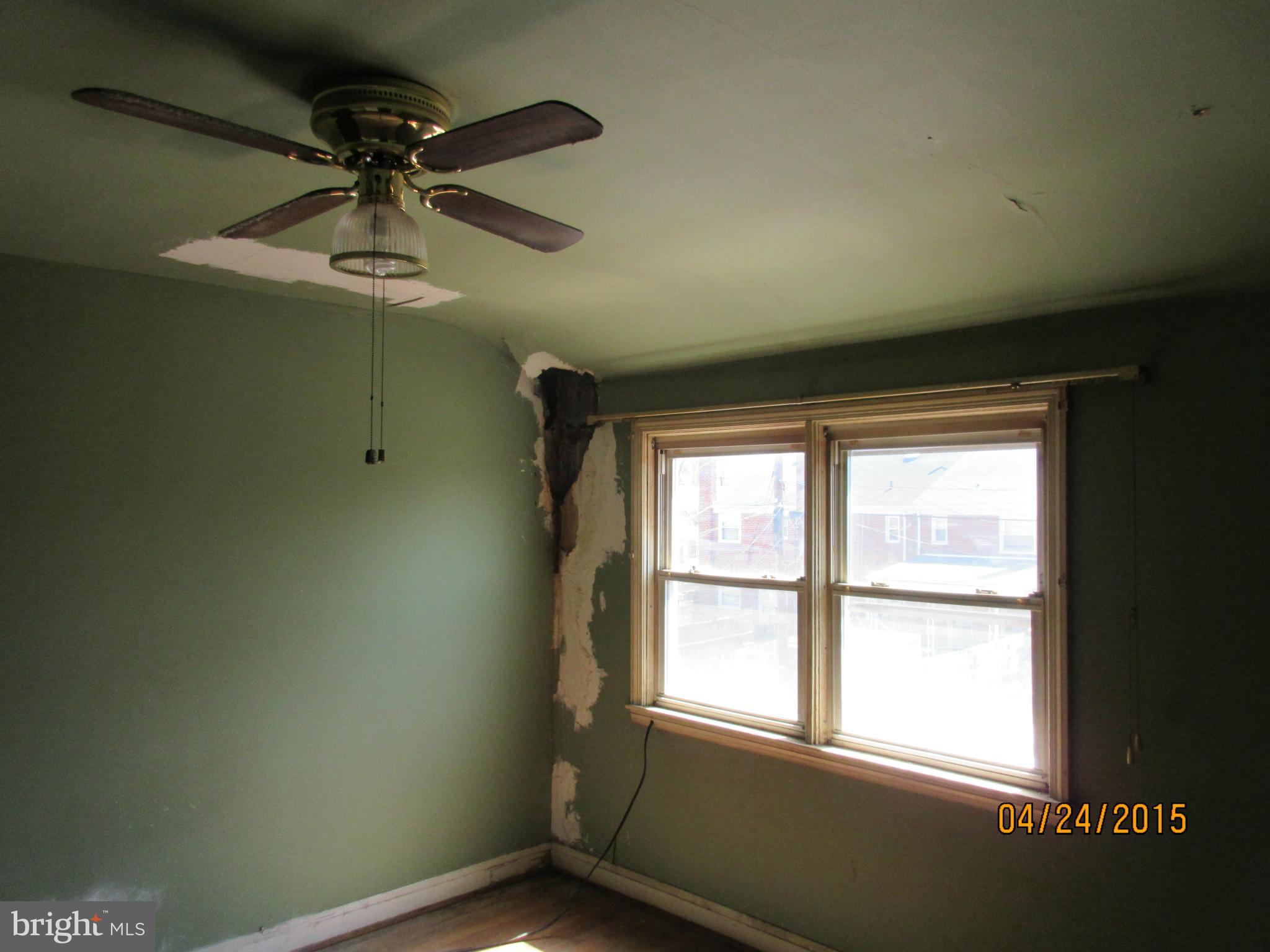 1909 Barry Road Baltimore, MD 21222 - Photo 10 of 12 an empty room with a window
