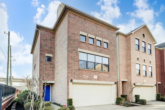 a front view of a building with many windows