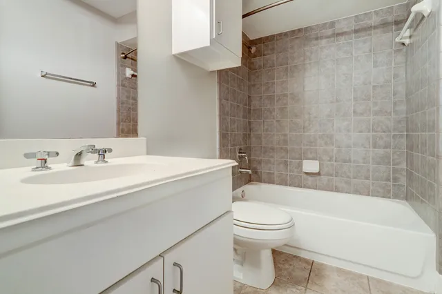 a bathroom with a sink a toilet and a bathtub