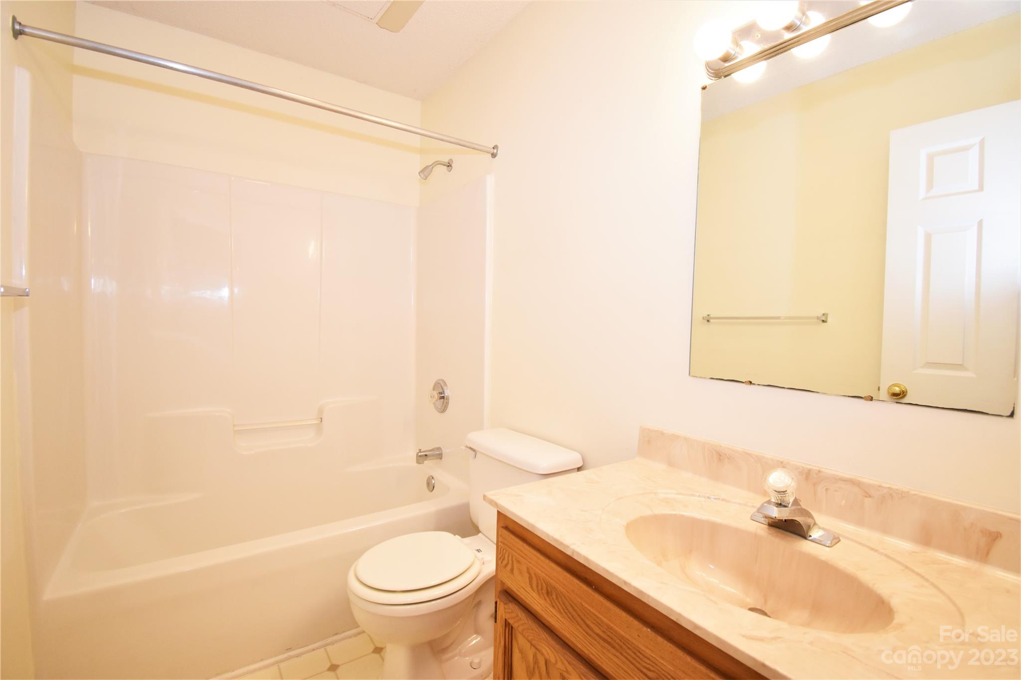 7 Krista Circle, Unit E Candler, NC 28715 - Photo 16 of 24 a bathroom with a sink toilet and shower