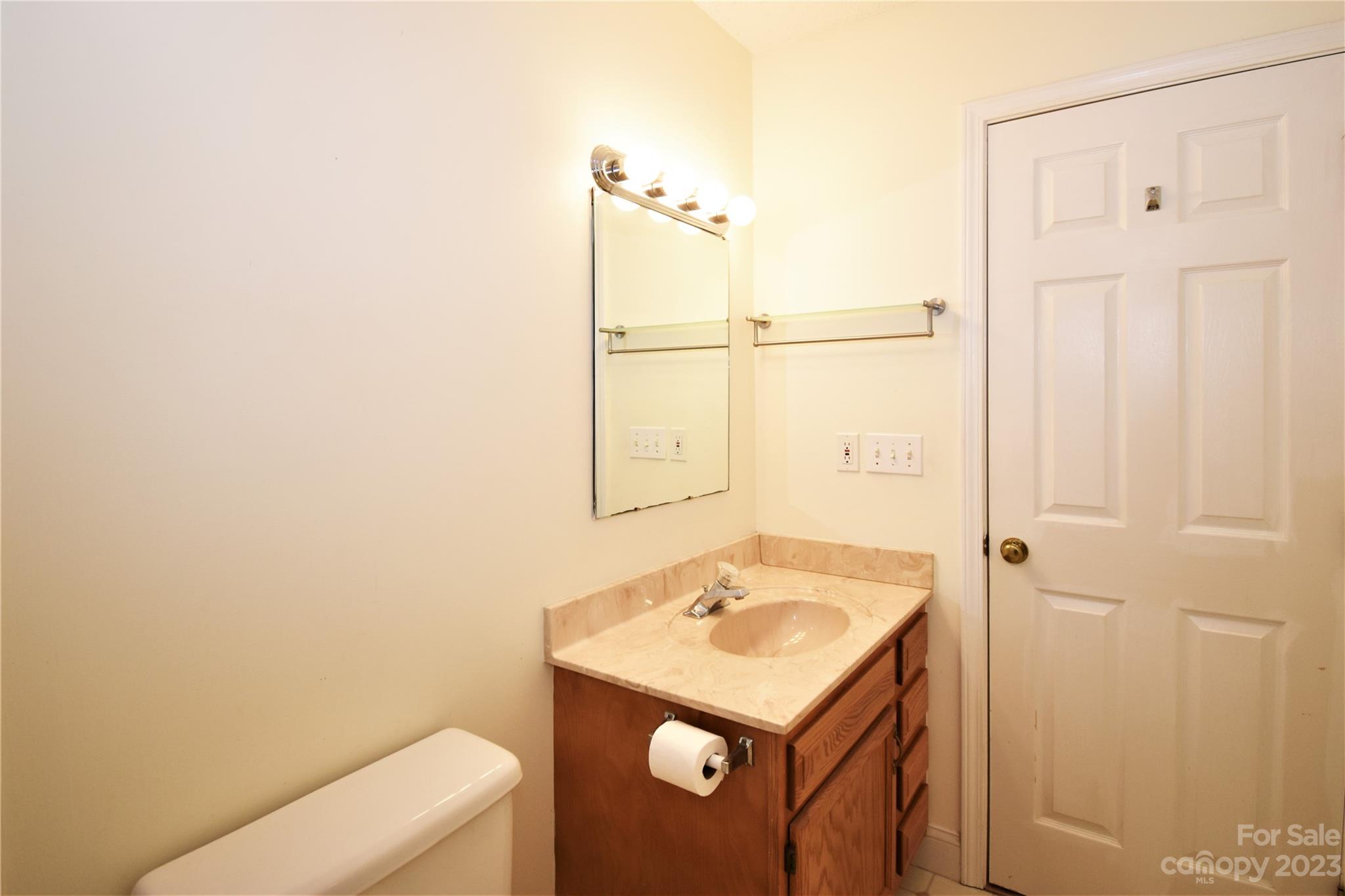 7 Krista Circle, Unit E Candler, NC 28715 - Photo 17 of 24 a bathroom with a sink a toilet and shower