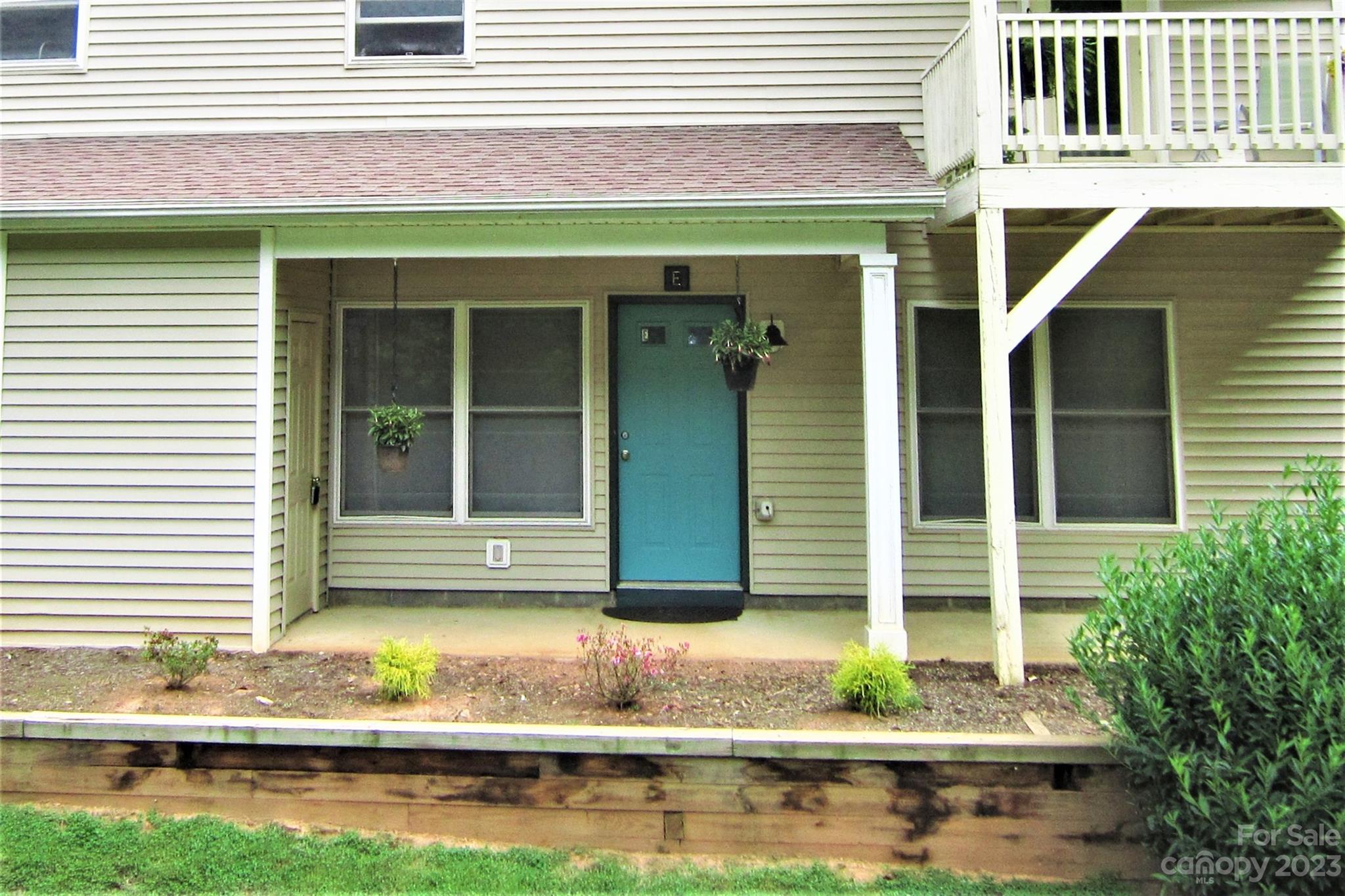 7 Krista Circle, Unit E Candler, NC 28715 - Photo 18 of 24 a front view of a house with a yard