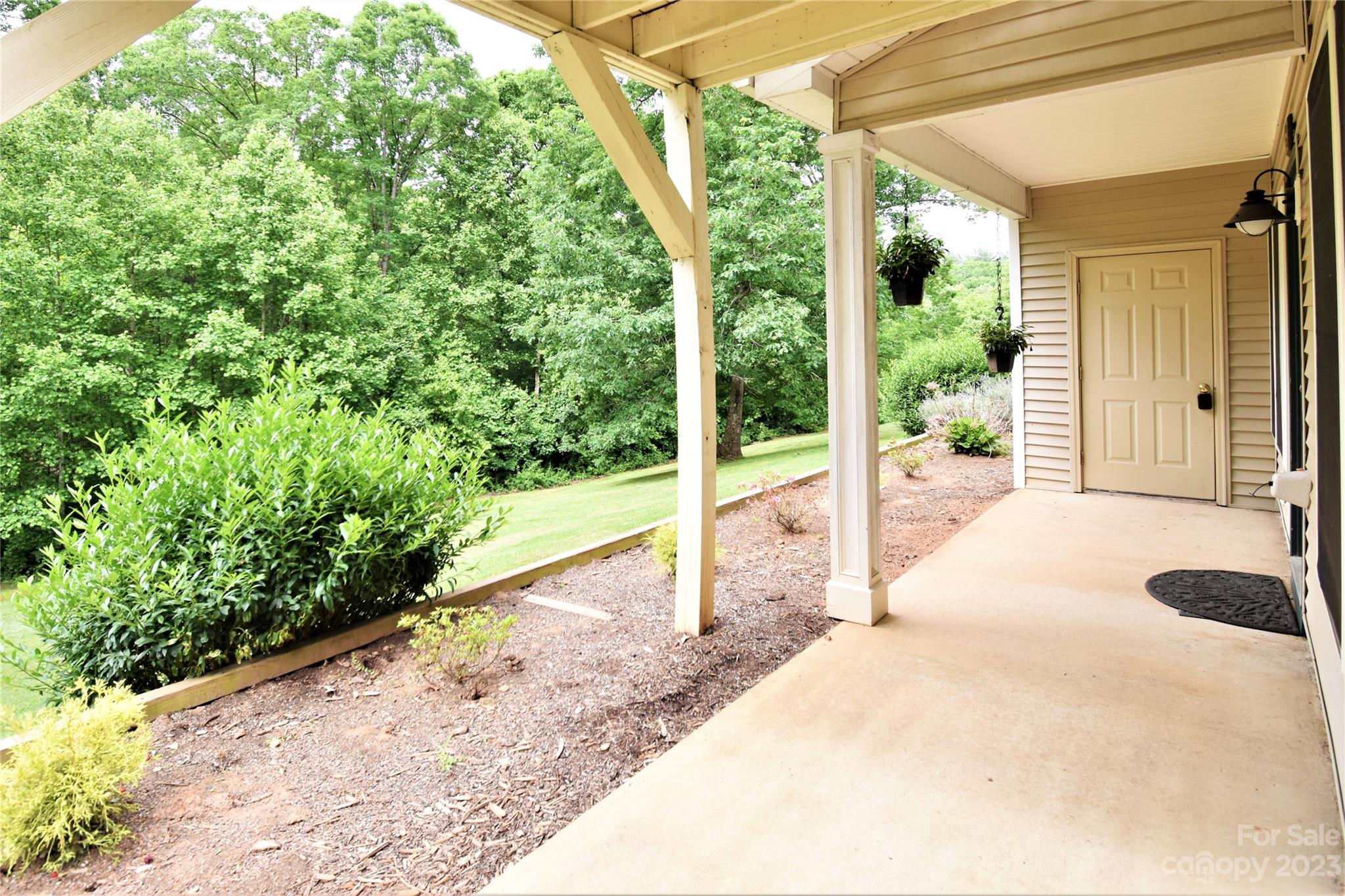 7 Krista Circle, Unit E Candler, NC 28715 - Photo 20 of 24 a view of a house with backyard and porch