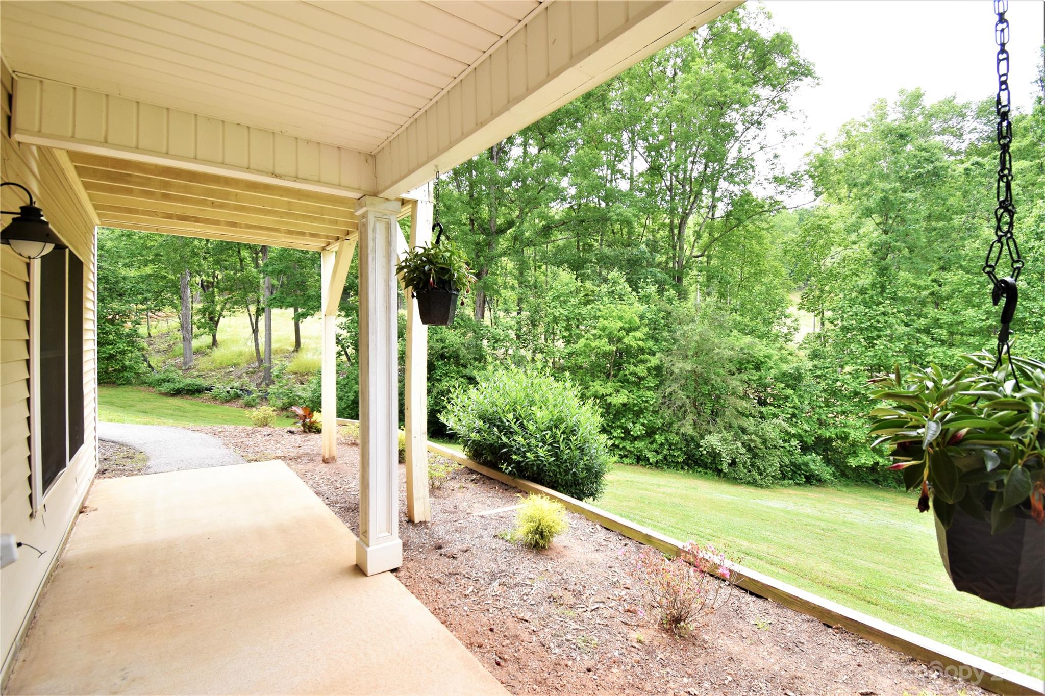 7 Krista Circle, Unit E Candler, NC 28715 - Photo 21 of 24 a view of a porch with potted plants